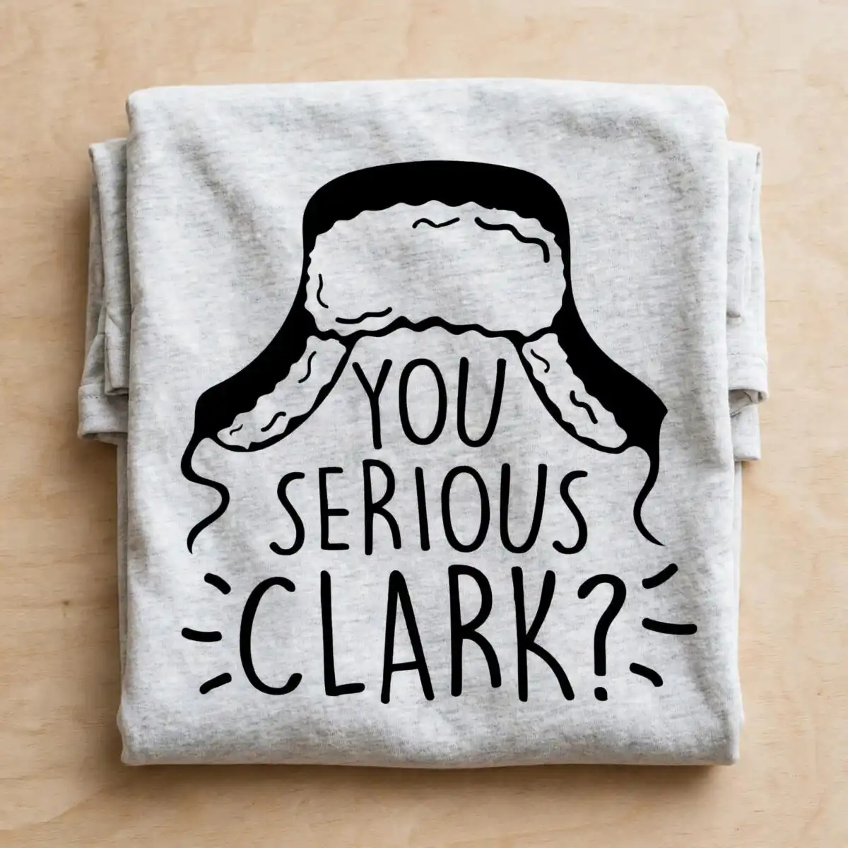 you serious clark christmas png design printed on a plain product mockup