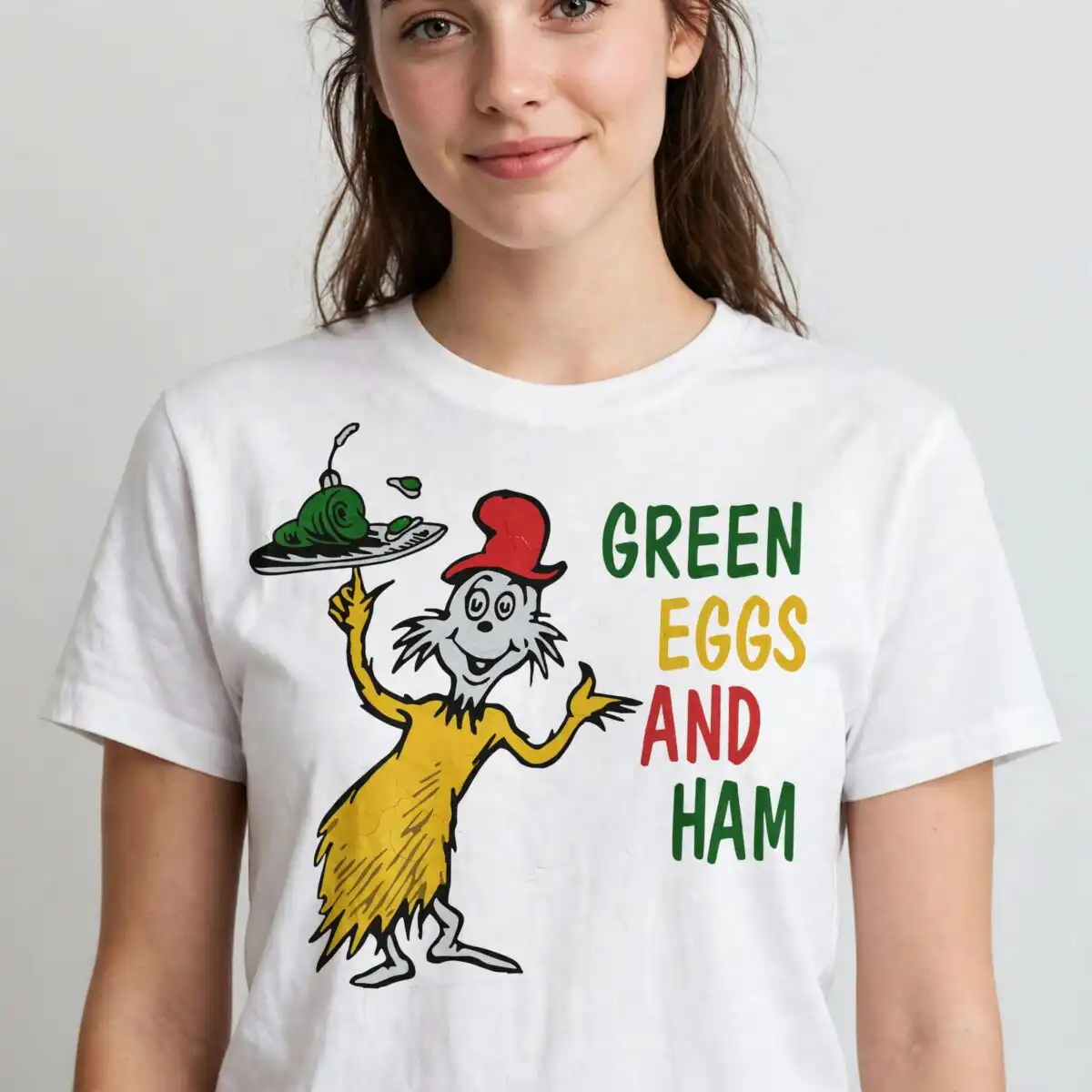 green eggs and ham shirt design with sam-i-am holding silver plate green eggs and ham shirt design design printed on a plain product mockup