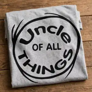 funny uncle of all things family phrase circular logo family uncle all things phrase svg design printed on a plain product mockup