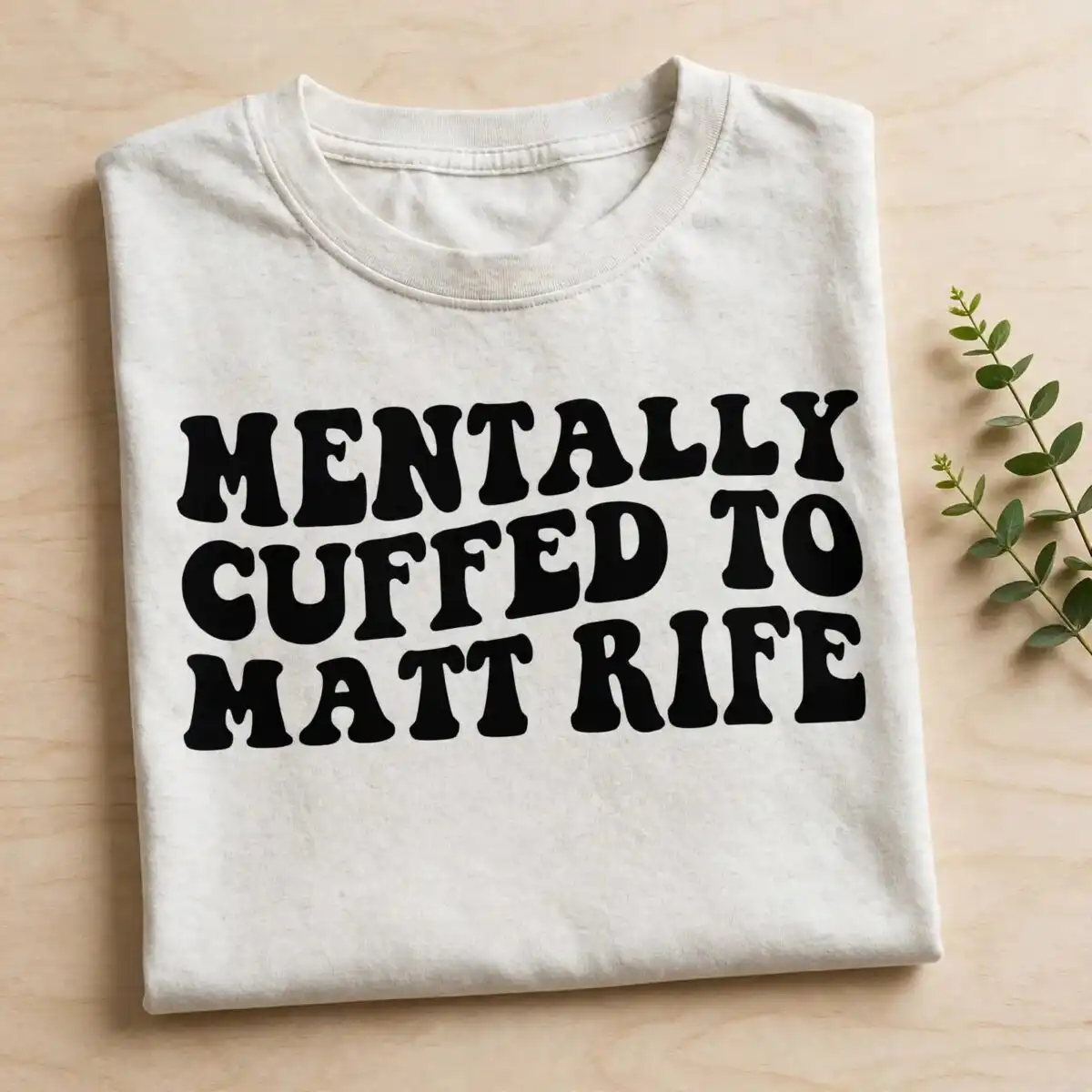 mentally cuffed matt rife svg design printed on a plain product mockup