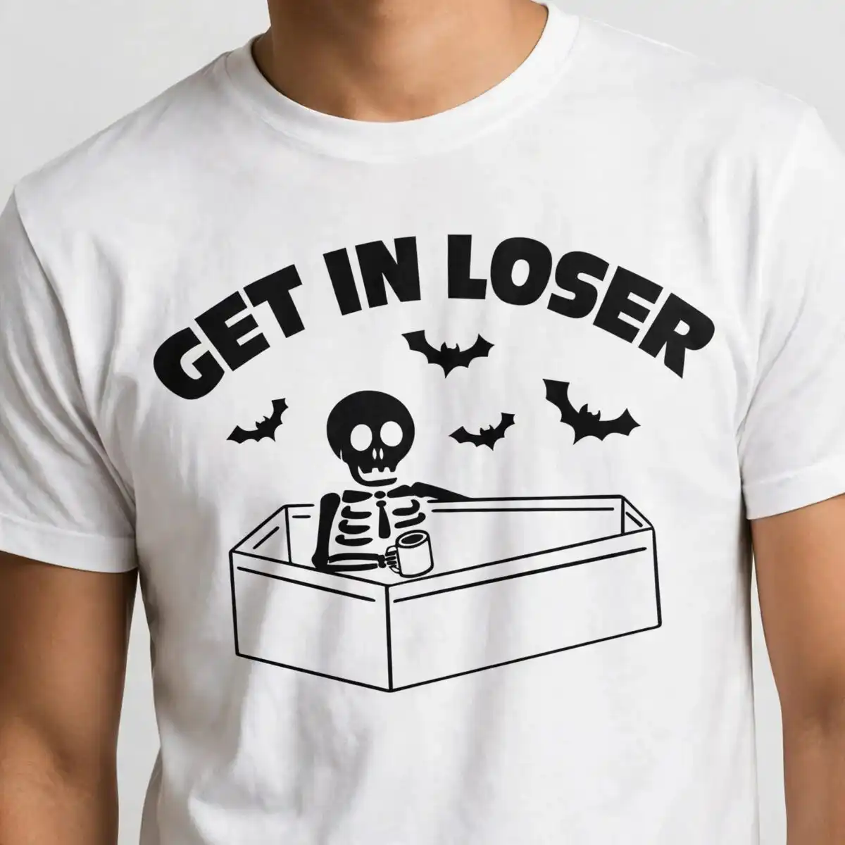 funny skeleton in coffin with get in loser text for halloween shirts skeleton get loser halloween svg design printed on a plain product mockup