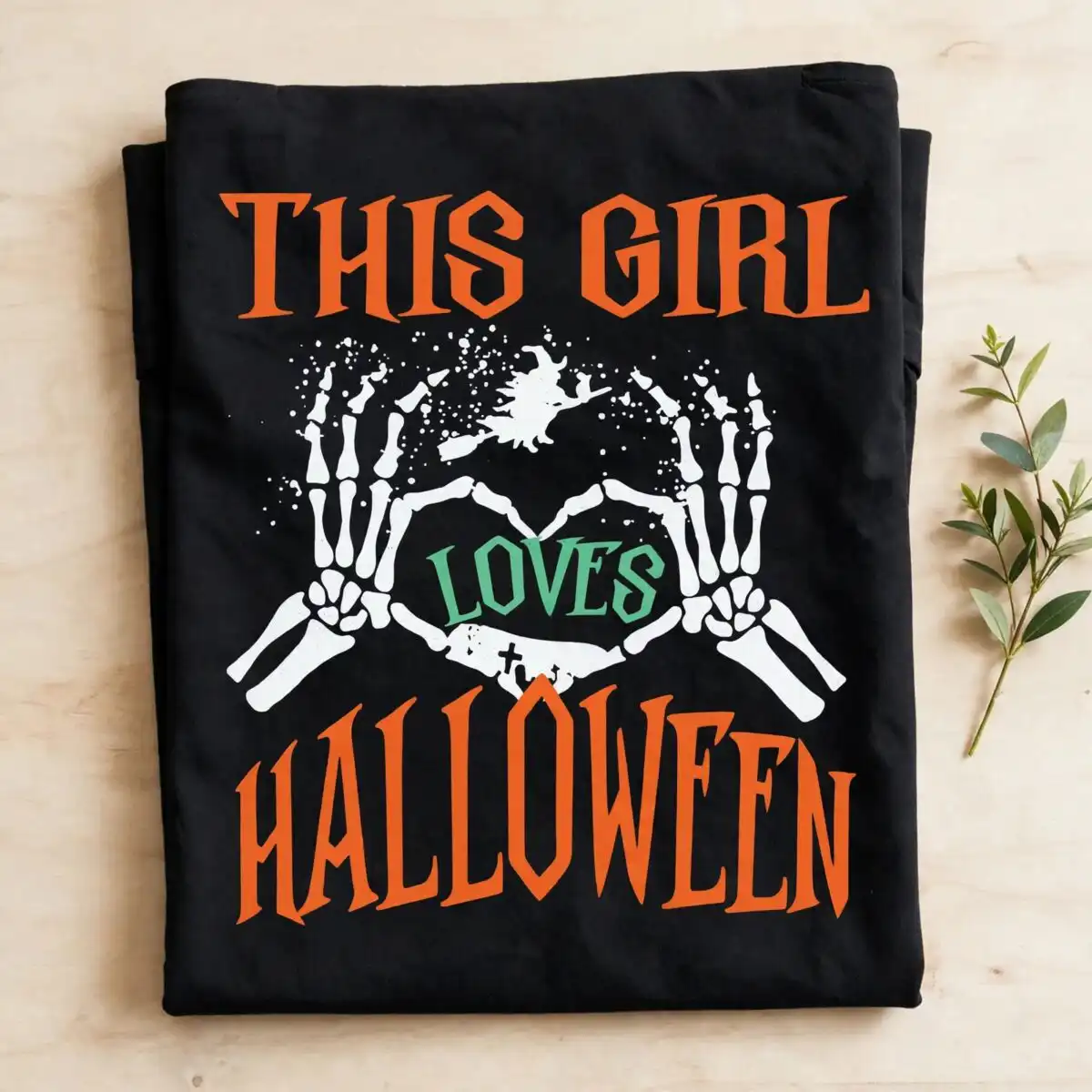 this girl loves halloween skeleton heart hands design for shirts and mugs skeleton heart hands svg design printed on a plain product mockup