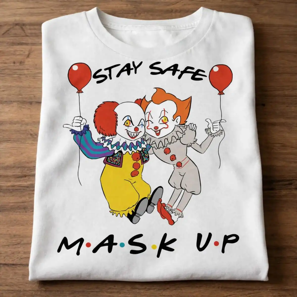 stay safe mask up design with two cartoon clowns and red balloons stay safe mask up svg design printed on a plain product mockup