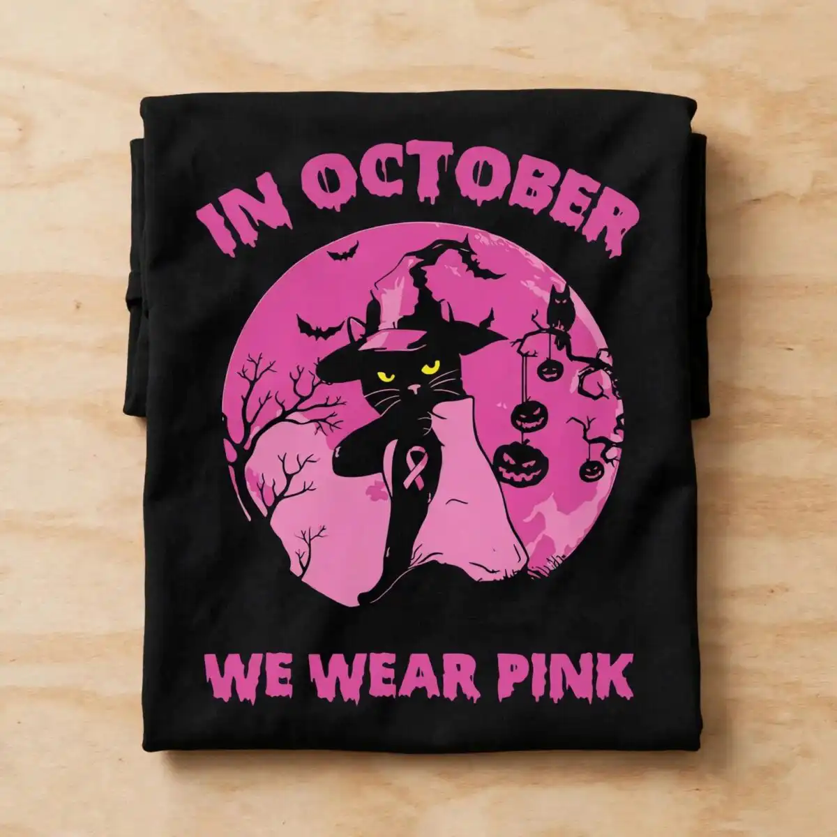 black cat in a witch hat halloween svg with pink ribbon and in october we wear pink black cat with witch hat clipart design printed on a plain product mockup