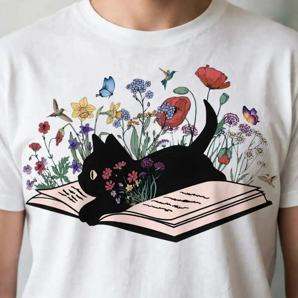 black cat lying on book with wildflowers png image for book lovers black cat png image design printed on a plain product mockup