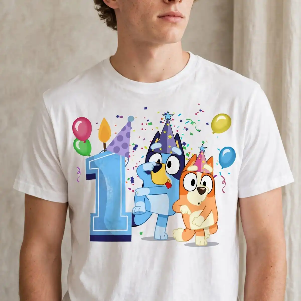 bluey 1st birthday party with two cartoon puppies and big number 1 bluey 1st birthday svg design printed on a plain product mockup