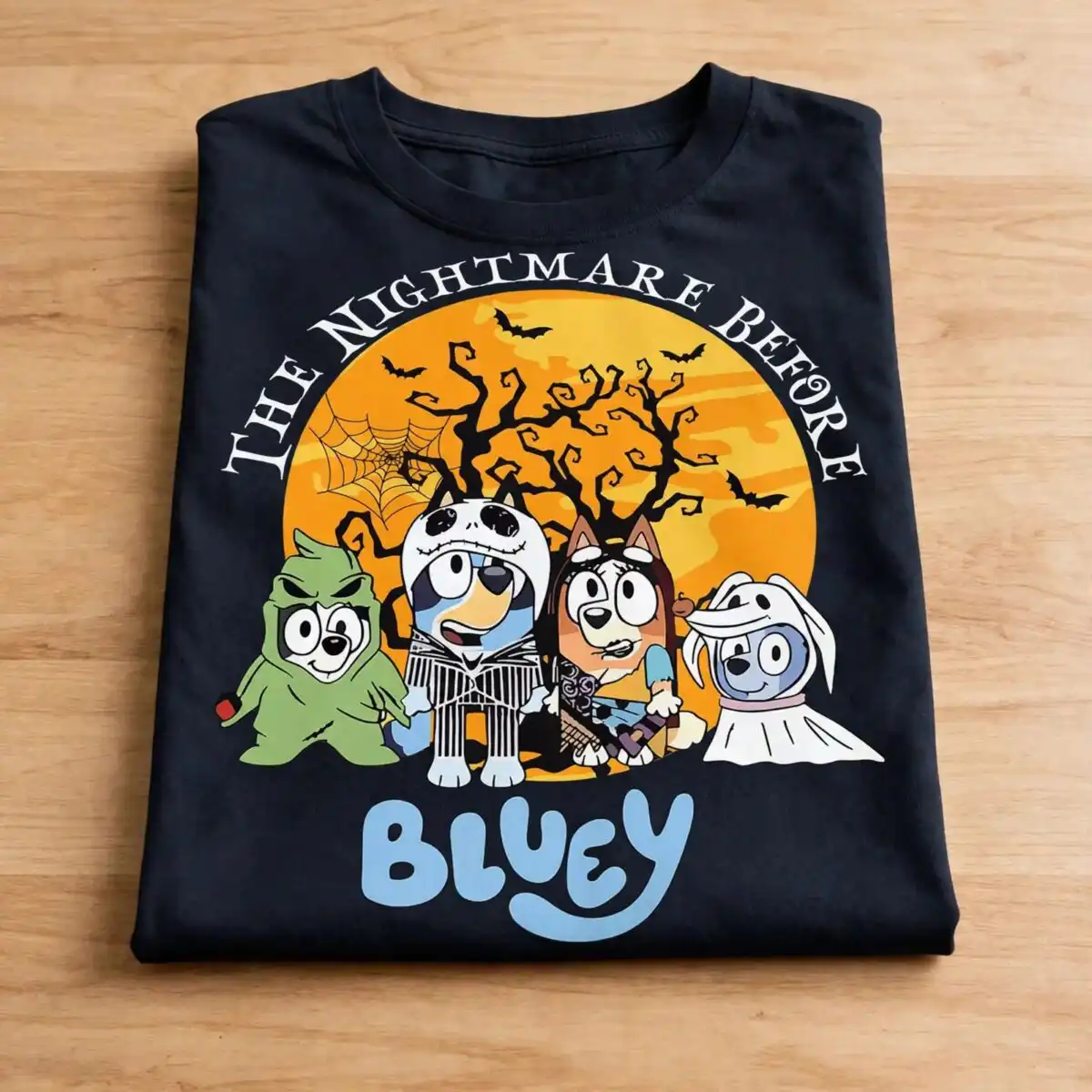 the nightmare before bluey halloween design with four costumed cartoon dogs bluey nightmare before halloween svg design printed on a plain product mockup