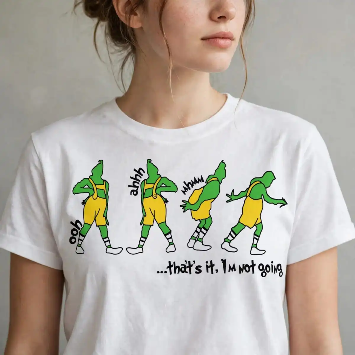 grinch that's it i'm not going png for sublimation four green figures in yellow overalls in various poses with text design printed on a plain product mockup