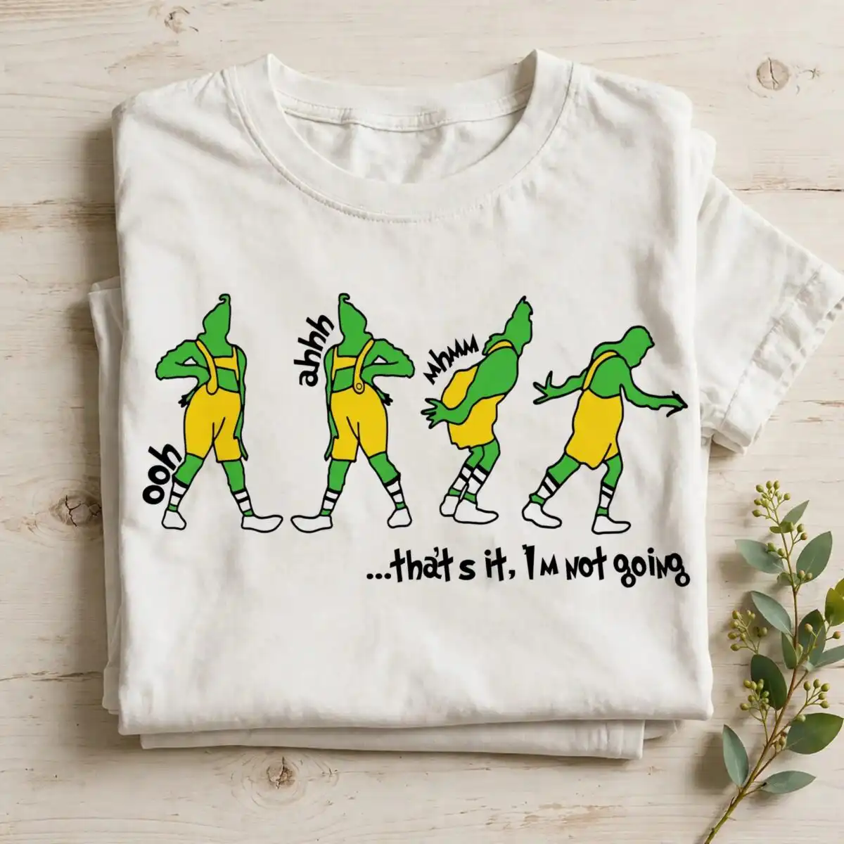 grinch that's it i'm not going png for sublimation four green figures in yellow overalls in various poses with text design printed on a plain product mockup