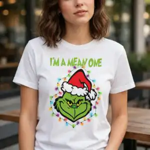 a green furry face wearing a Santa hat and surrounded by Christmas lights design printed on a plain product mockup