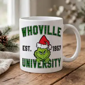 a green furry character wearing a Santa hat with text above and below design printed on a plain product mockup