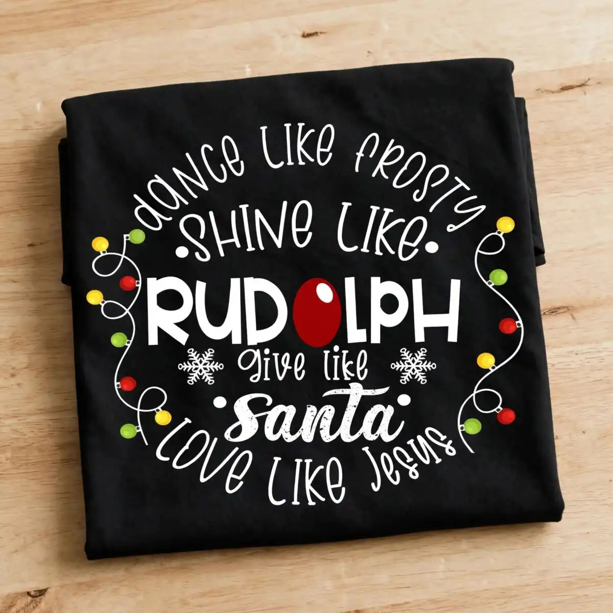 dance like frosty shine like rudolph png design printed on a plain product mockup