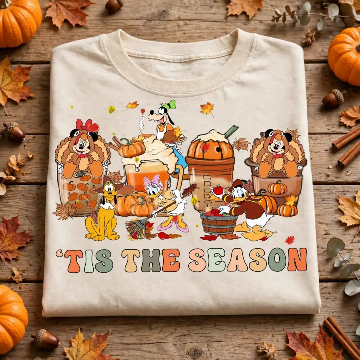 tis the season thanksgiving shirt art with cartoon pumpkin spice cups tis season thanksgiving thanksgiving shirt png design printed on a plain product mockup