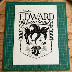 chibi baby edward scissorhands badge with edward scissorhands lettering edward scissorhands svg design printed on a plain product mockup