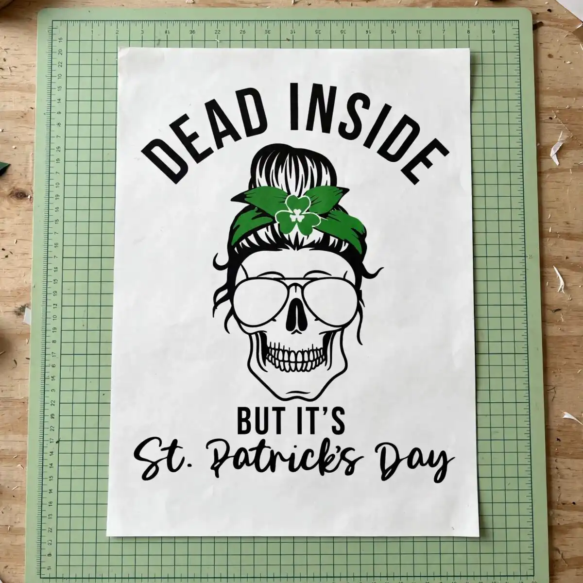 st patrick's day female skull messy bun svg design printed on a plain product mockup