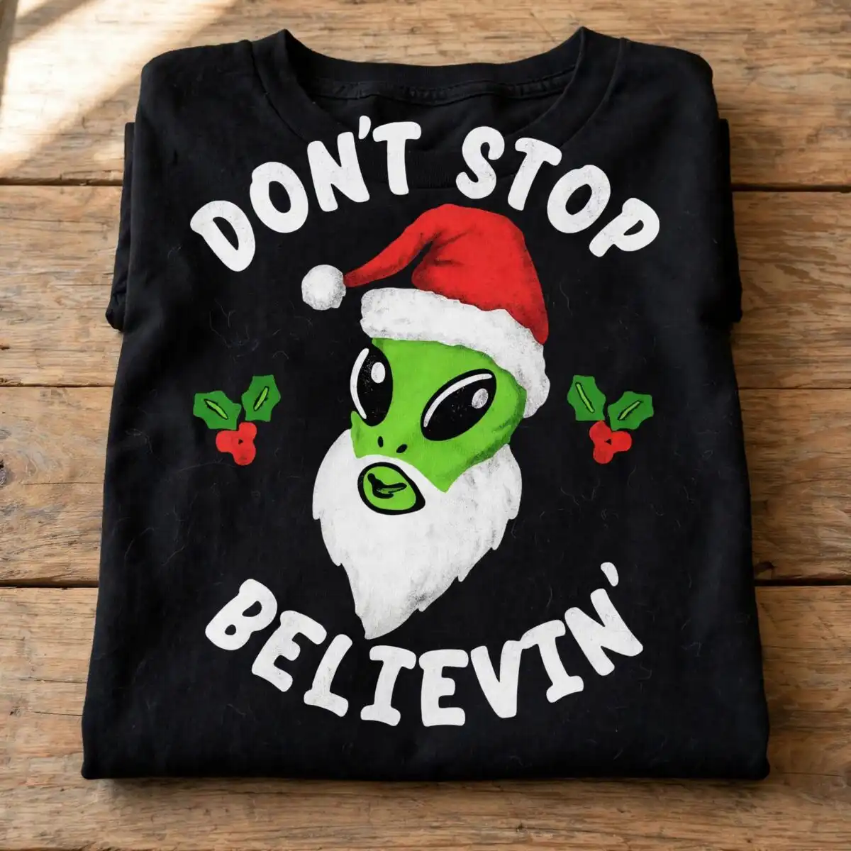 alien don't stop belive christmas shirt design with santa hat alien don't stop belive svg design printed on a plain product mockup