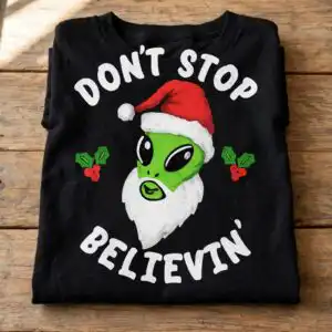 alien don't stop belive christmas shirt design with santa hat alien don't stop belive svg design printed on a plain product mockup