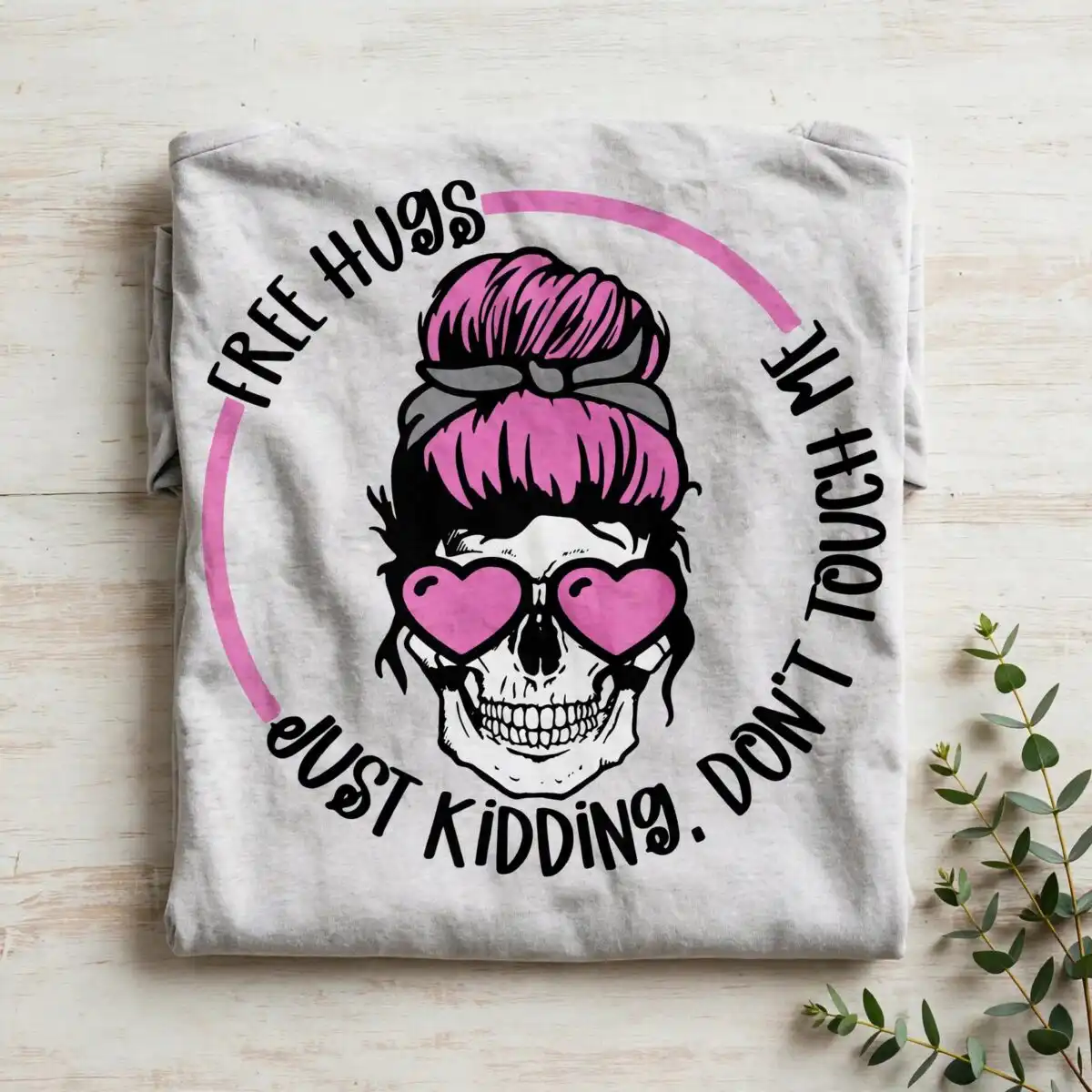 sassy skull pink messy bun hugs just kidding dont touch me badge hugs just kidding dont svg design printed on a plain product mockup