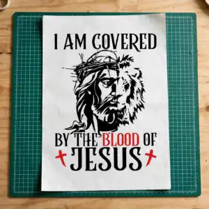 cross with jesus religious portrait - i am covered by the blood design cross with jesus svg design printed on a plain product mockup