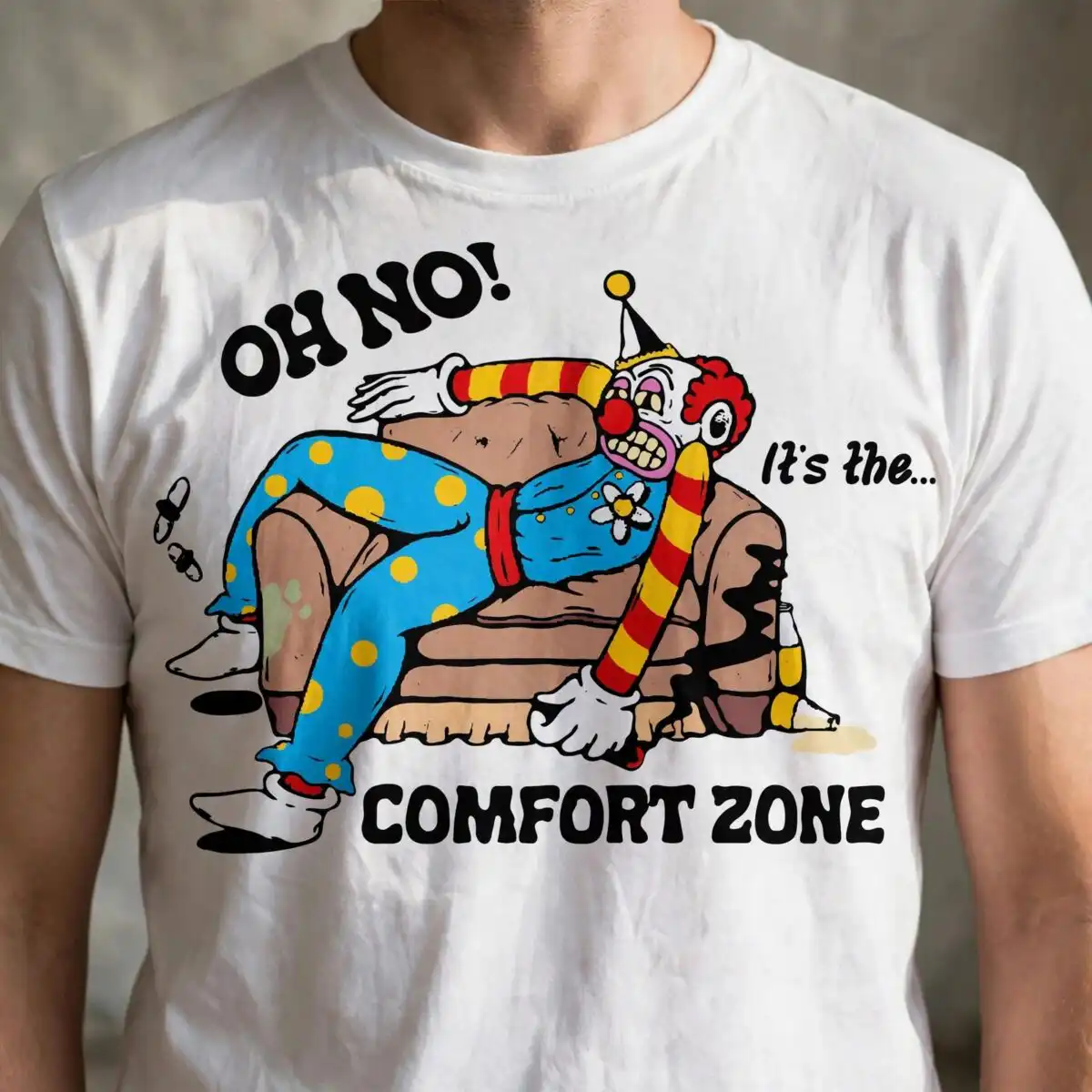 cartoon clown like figure svg shirt design: lazy halloween comfort zone clown on a couch cartoon clown like figure svg design printed on a plain product mockup