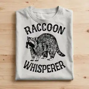 funny raccoon whisperer badge design for shirts, mugs and decals funny raccoon svg design printed on a plain product mockup