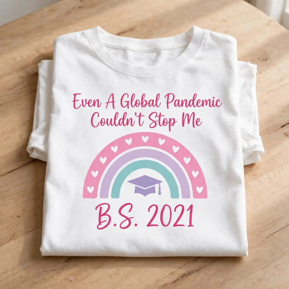 graduation rainbow text even svg design printed on a plain product mockup