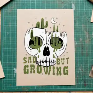 sad but growing white skull desert cactus boho graphic for adults sad but growing svg design printed on a plain product mockup