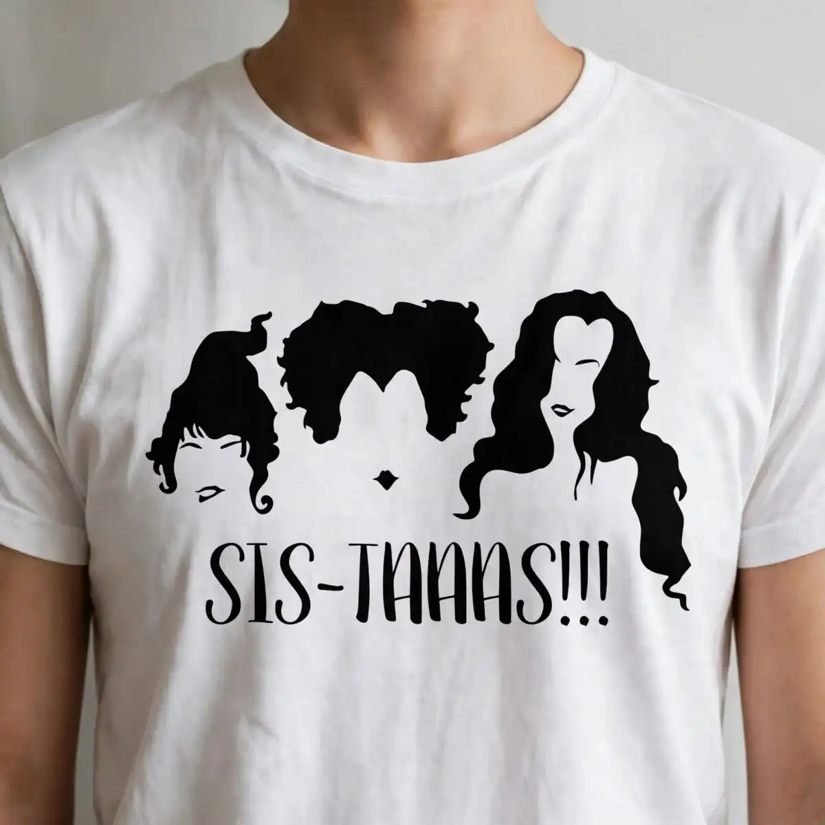 halloween sis-taaas!!! silhouette design featuring three female heads with curly and wavy three silhouetted female heads svg design printed on a plain product mockup