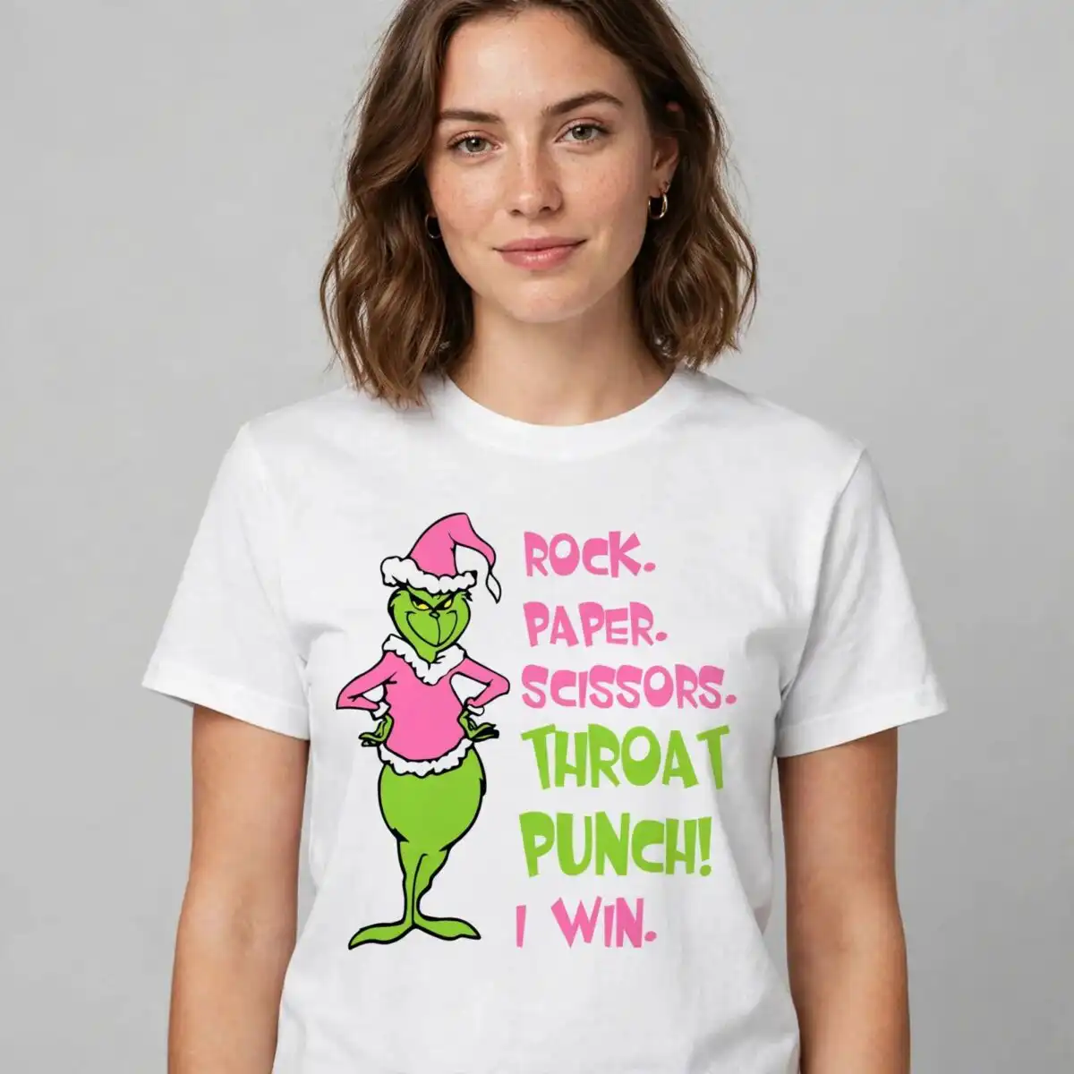 pink grinch rock paper scissors throat punch character bundle A green, grumpy character wearing a pink Santa hat and shirt, standing next to a playful quote. design printed on a plain pro