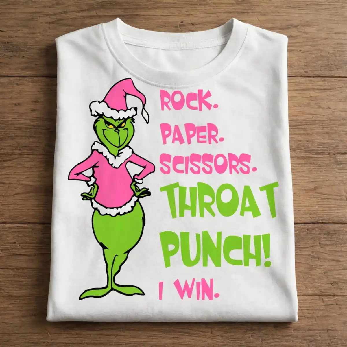 pink grinch rock paper scissors throat punch character bundle A green, grumpy character wearing a pink Santa hat and shirt, standing next to a playful quote. design printed on a plain pro