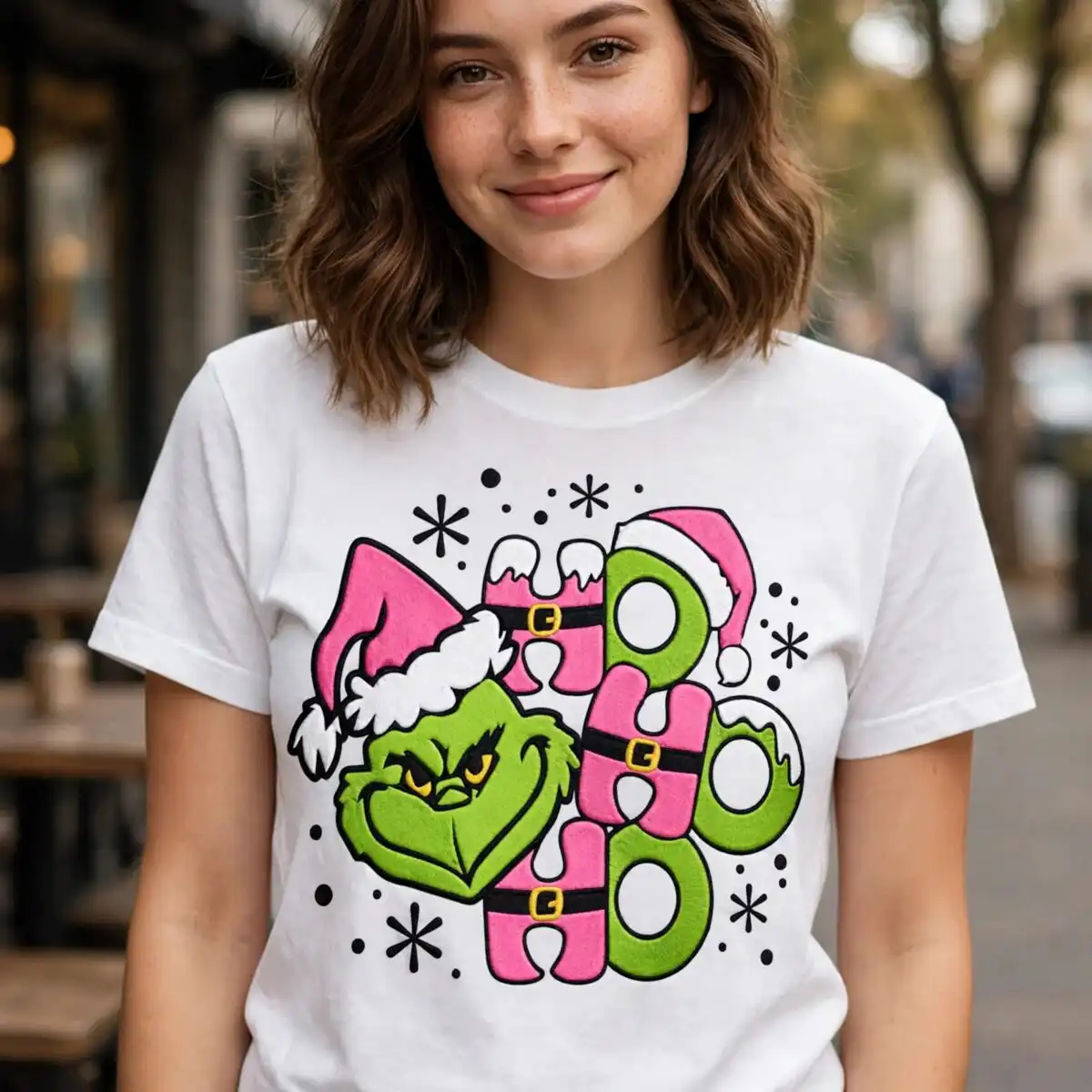 ho ho ho grinch christmas design for t-shirts and mugs a green furry character with a pink Santa hat and the word HO HO HO design printed on a plain product mockup
