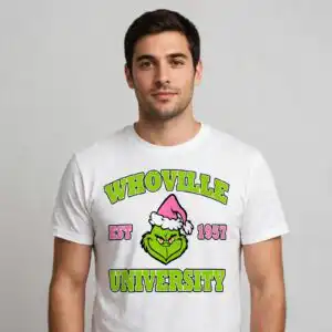 pink grinch whoville est university christmas svg for crafters a green creature wearing a pink Santa hat with text around it design printed on a plain product mockup