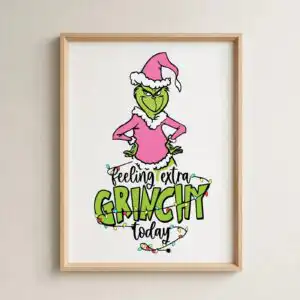 feeling extra grinchy today grinch svg - pink grinchmas design A green character with a pink Santa hat and outfit, surrounded by Christmas lights and text. design printed on a plain produc