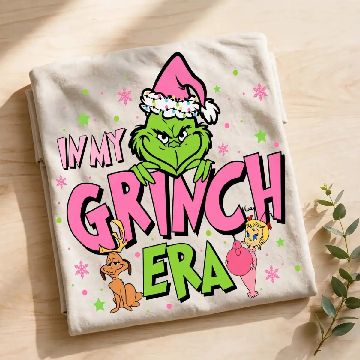 festive grinch clip art for christmas crafts A green monster wearing a pink Santa hat, with a dog and a girl, surrounded by text and small decorative elements. design pri