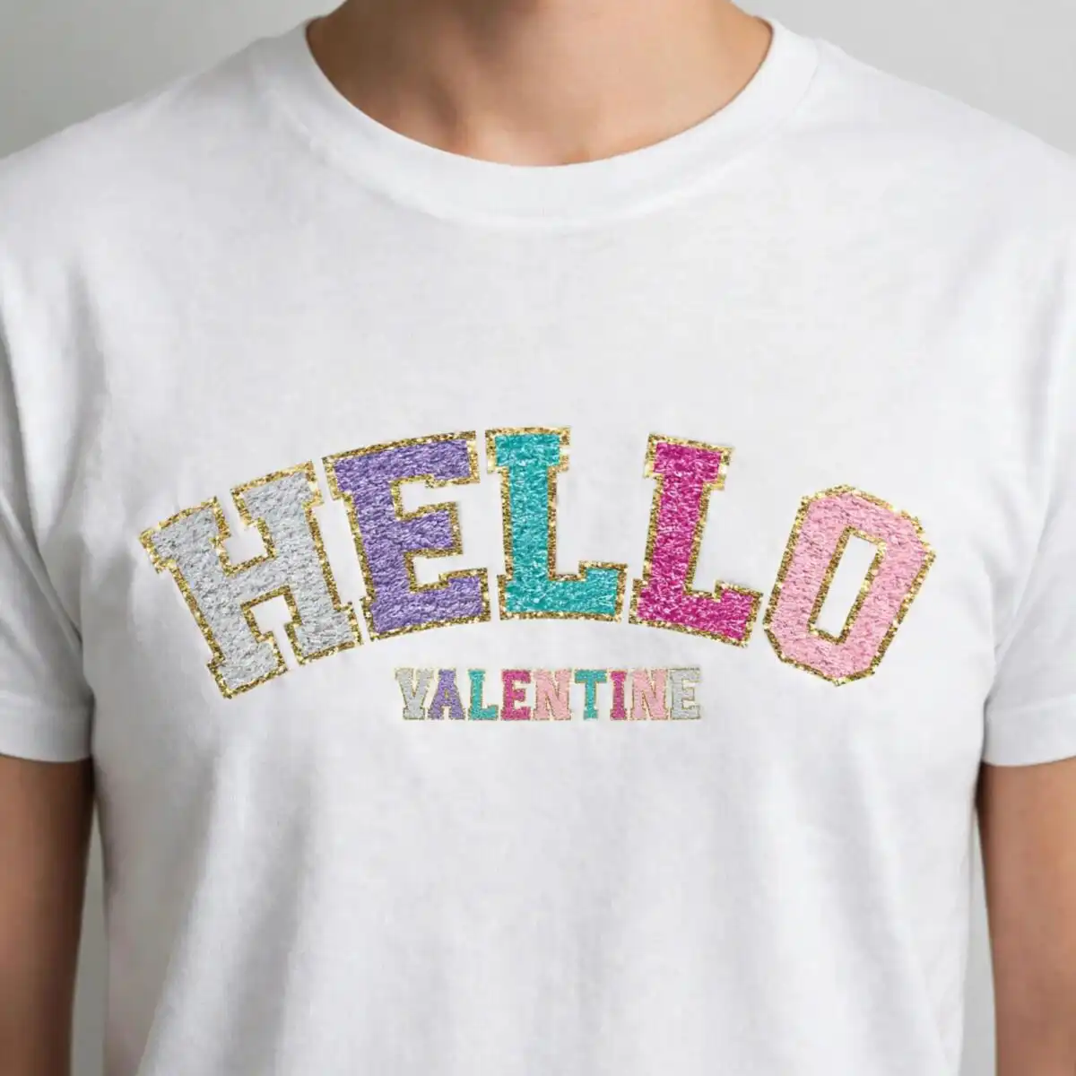 hello valentine chenille-style varsity lettering with gold glitter outline for hello valentine valentine quotes png design printed on a plain product mockup