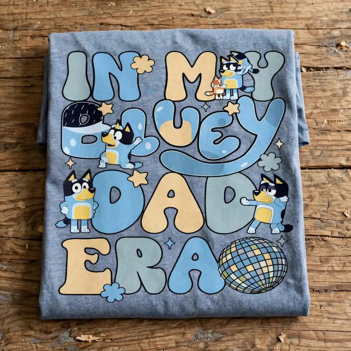 in my bluey dad era family stacked bubble letter phrase design for dad shirts family stacked bubble letter phrase png design printed on a plain product mockup